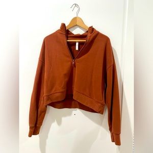 Fabletics cropped burnt orange half zip sweatshirt